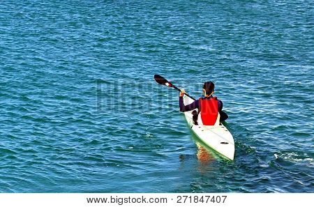Kyak Rider During The Competition In The Warm Waters Of The Ocean.