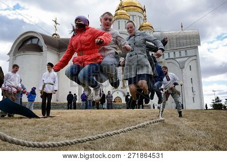 Russia, City Of Magnitogorsk, Chelyabinsk Region - April 12, 2015. Children Jump Through The Rope At