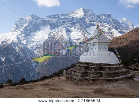 Buddhist White Stupa With Prayer Flags Above Namche Bazaar On The Way To Everest Base Camp, Sagarmat