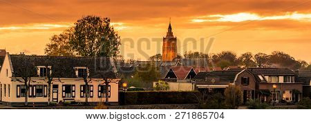 City Skyline View Of Leerdam The Netherlands At Sunset, A Typical Dutch City.