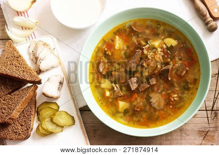 Rassolnik, Traditional Russian Soup, Served With Various Snacks And Vodka. Rustic Style.