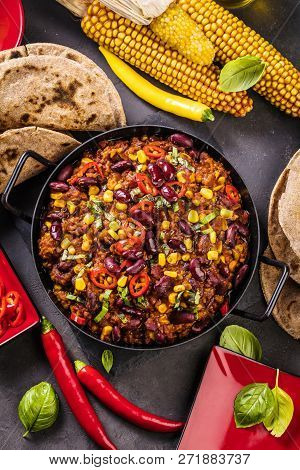 Chili Con Carne In A Clay Bowl On A Concrete Or Stone Rustic Background- Traditional Dish Of Mexican