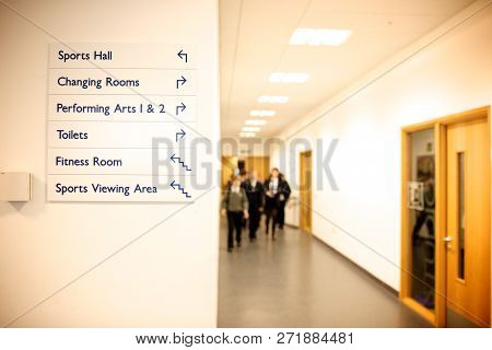 Secondary School Corridor With Signage To Sports Hall, Changing Rooms, Performing Arts, Toilets, Fit