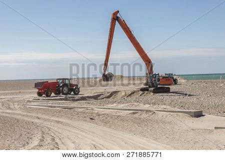 Excavator On The Beach In Norre Vorupor, Denmark, Europe.
