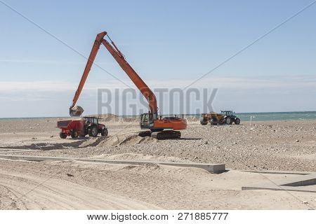 Excavator On The Beach In Norre Vorupor, Denmark, Europe.