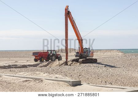 Excavator On The Beach In Norre Vorupor, Denmark, Europe.