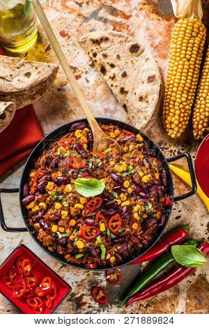 Chili Con Carne In A Clay Bowl On A Concrete Or Stone Rustic Background- Traditional Dish Of Mexican