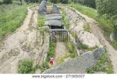 Little Boy Visitor Discovering Dolmen Of Lacara, Ancient Megalithic Building,  Extremadura. Spain. A