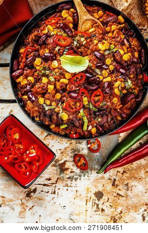 Chili Con Carne In A Clay Bowl On A Concrete Or Stone Rustic Background- Traditional Dish Of Mexican