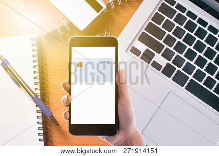 Businessman Checking The Transfer Payment With Holding A Credit Card