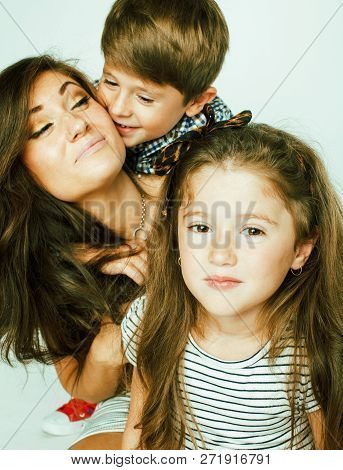 Young Mother With Two Children On White Background, Happy Smilin