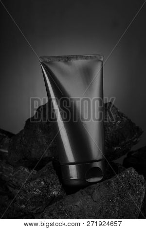 Black Carbon Charcoal Facewash For Mockup On Coal Background