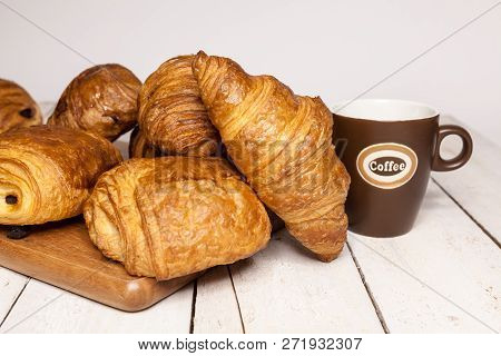 An Buttercake With Raisins And Croissant Is Made Of Puff Pastry