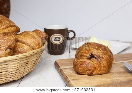 An Buttercake With Raisins And Croissant Is Made Of Puff Pastry