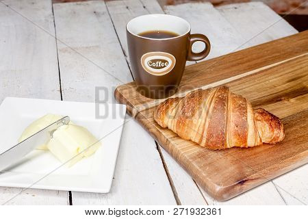 An Buttercake With Raisins And Croissant Is Made Of Puff Pastry
