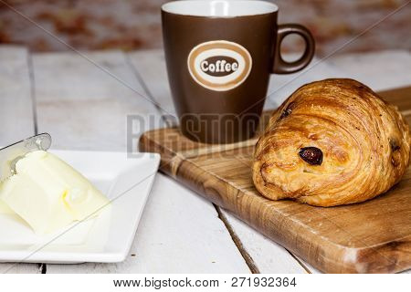 An Buttercake With Raisins And Croissant Is Made Of Puff Pastry