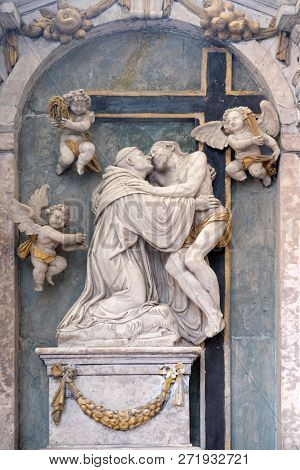 BRONNBACH, GERMANY - JULY 07, 2018:Christ strengthens the praying Bernard of Clairvaux, Bernard altar from the workshop of Michael Kern, Cistercian Abbey of Bronbach in Reicholzheim, Germany