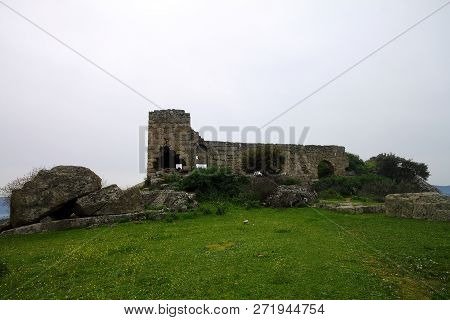 Ruined Walls Of Castle Over The Lake Bafa In A Nature Reserve Situated In Southwestern Turkey