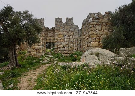 Ruined Walls Of Castle Over The Lake Bafa In A Nature Reserve Situated In Southwestern Turkey