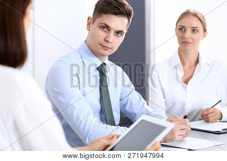 Group Of Business People Or Lawyers Discussing  Terms Of Transaction In Office. Colleagues Working A