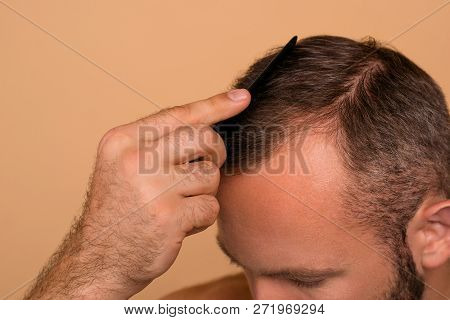 Close-up Cropped View Of Nice Attractive Handsome Brunet Guy Combing Dark Grey Hair Healthy Domestic