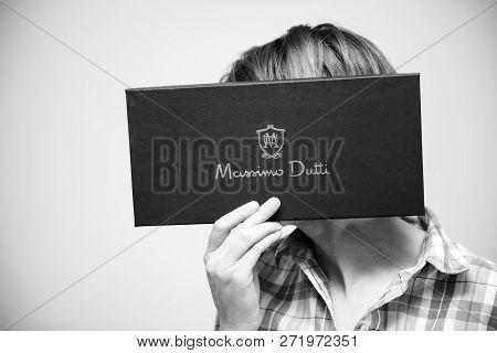 Paris, France - Dec 2, 2018: Woman Holding In Front Of Her Face Behind Black Shoes Cardboard From Ma