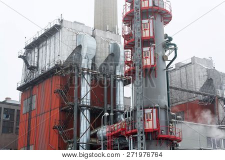 Old A New Chimneys At Heating Plant Covered In Fog, Cloudy Winter Day, Low Angle View, Energy Produc