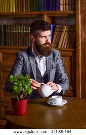 Portrait Of Bearded Man Drinking Tea N Vintage Library