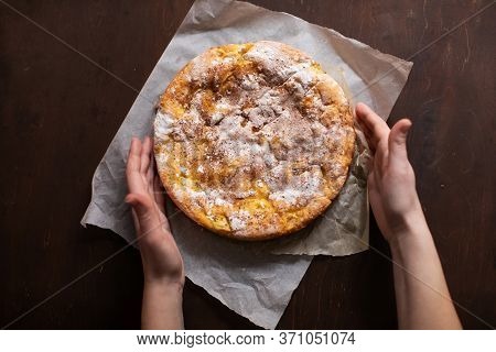 Woman Holding Homemade Apple Pie In Her Hands