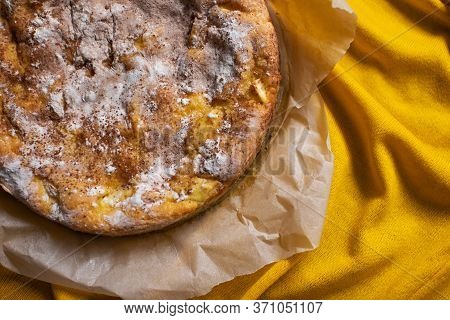 Delicious Homemade Pie With Apples And Cinnamon On Yellow Background
