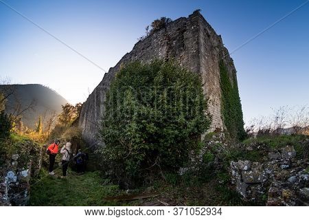 Ripafratta, Italy - January 06, 2020:  Unknown People During Trekking In The Medieval Village Of Rip