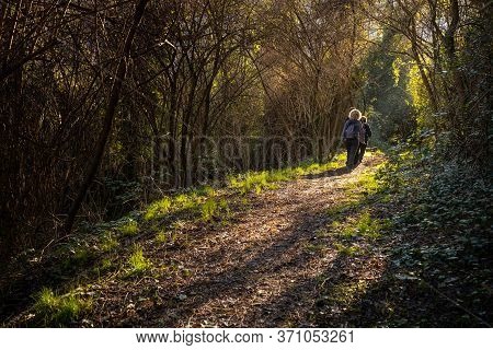 Ripafratta, Italy - January 06, 2020:  Unknown People During Trekking In The Medieval Village Of Rip