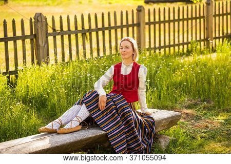 Latvian Woman In Traditional Clothing. Ligo Folk.