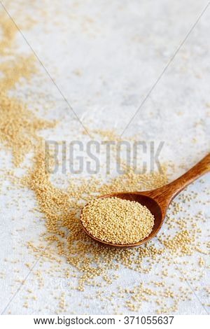 Spoon Of Raw Amaranth Grain Close Up On A White Table