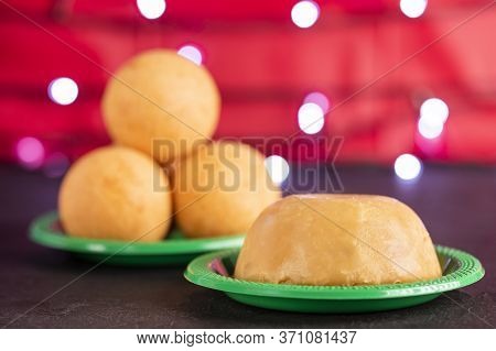 Traditional Colombian Bunuelos (deep Fried Cheese Bread) And Natilla On Christmas