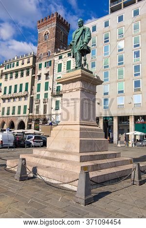 Genoa, Italy - August 18, 2019: Raffaele Rubattino Statue By The Augusto Rivalta, 1889, And The Towe