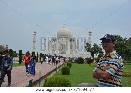 Agra, Uttar Pradesh, India, 9th August, 2018:   Indian Tourist Posing For Photograph Before The Famo