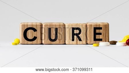 Cubes With The Word Cure On Them. Care Concept.