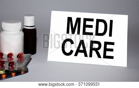 Medi Care Text On White Paper And Pills