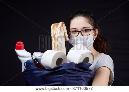 Young Woman In Protective Mask With A Bag Full Of Groceries From The Supermarket
