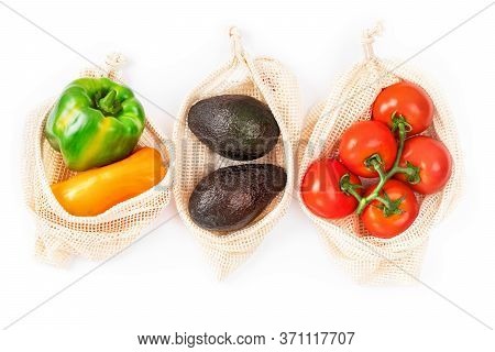 Tomatoes, Pepper, Avocado In Mesh Textile Bag. Eco Friendly Bag With Organic Vegetables On White Bac
