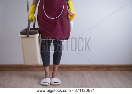 Close Up View Of Body Of Young Woman Holding Stuff For Cleaner Ready To Cleaning House.