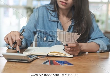 Woman Doing Accounting Home Finance Expenses And Calculate Credit Card Monthly Debt To Bills Payment