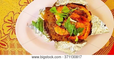 Top View Or Flat Lay Sweet Casseroled Prawns With Vermicelli, Tang Dong On Shredded Paper In Pink Di