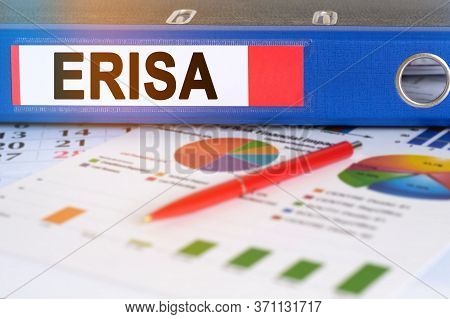 On The Table Are Pie Charts, A Pen And A Folder With The Inscription - Erisa. The Employee Retiremen