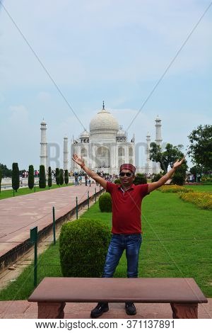 Agra, Uttar Pradesh, India, 9th August, 2018:   Indian Tourist Posing For Photograph Before The Famo