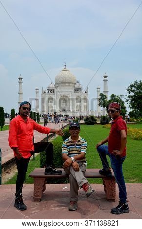 Agra, Uttar Pradesh, India, 9th August, 2018:   Indian Tourist Posing For Photograph Before The Famo