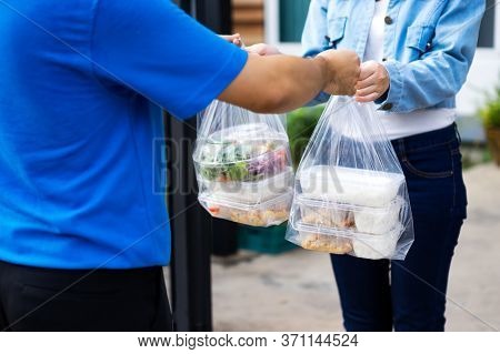 Asian Delivery Man Delivering Food, Fruit, Joice And Vegetable To Customer Home - Online Grocery Sho