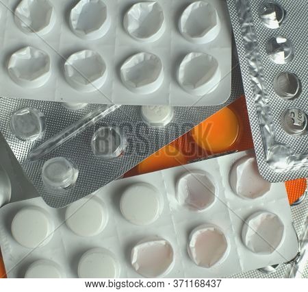 Heath, Healthcare Costs, Drugs, Medicines And Pills. Closeup Shot Of Multiple Pill Blisters Piled On