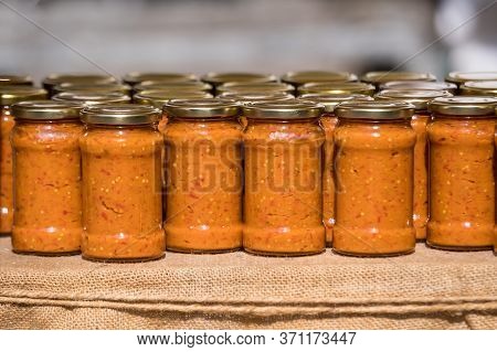 Row Of Glass Jars With Freshly Home Cooked Zacusca - Traditional Balkan And East European Food Made 